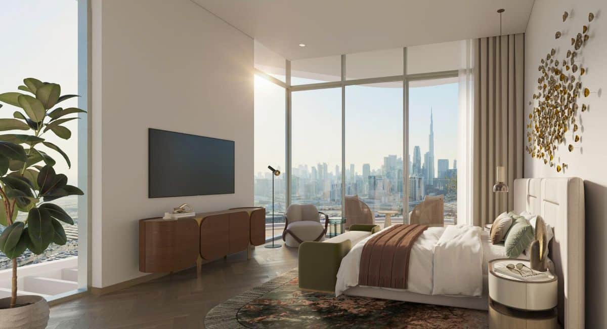 Гостиная квартиры в комплексе Artistry One Residences с панорамными окнами, откуда открывается вид на горизонт